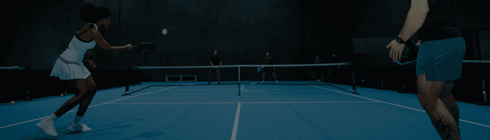 Players on a pickleball court, illustrating the RC Difference